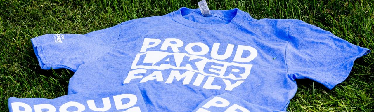 T-shirts with text that says "proud Laker family"